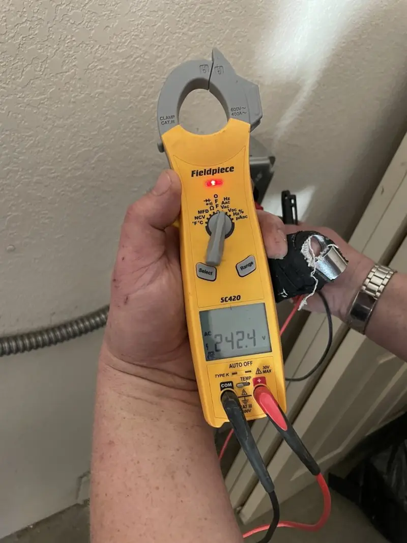 Voltage testing with clamp meter during Ceiling Fan Installation in Fairview Heights